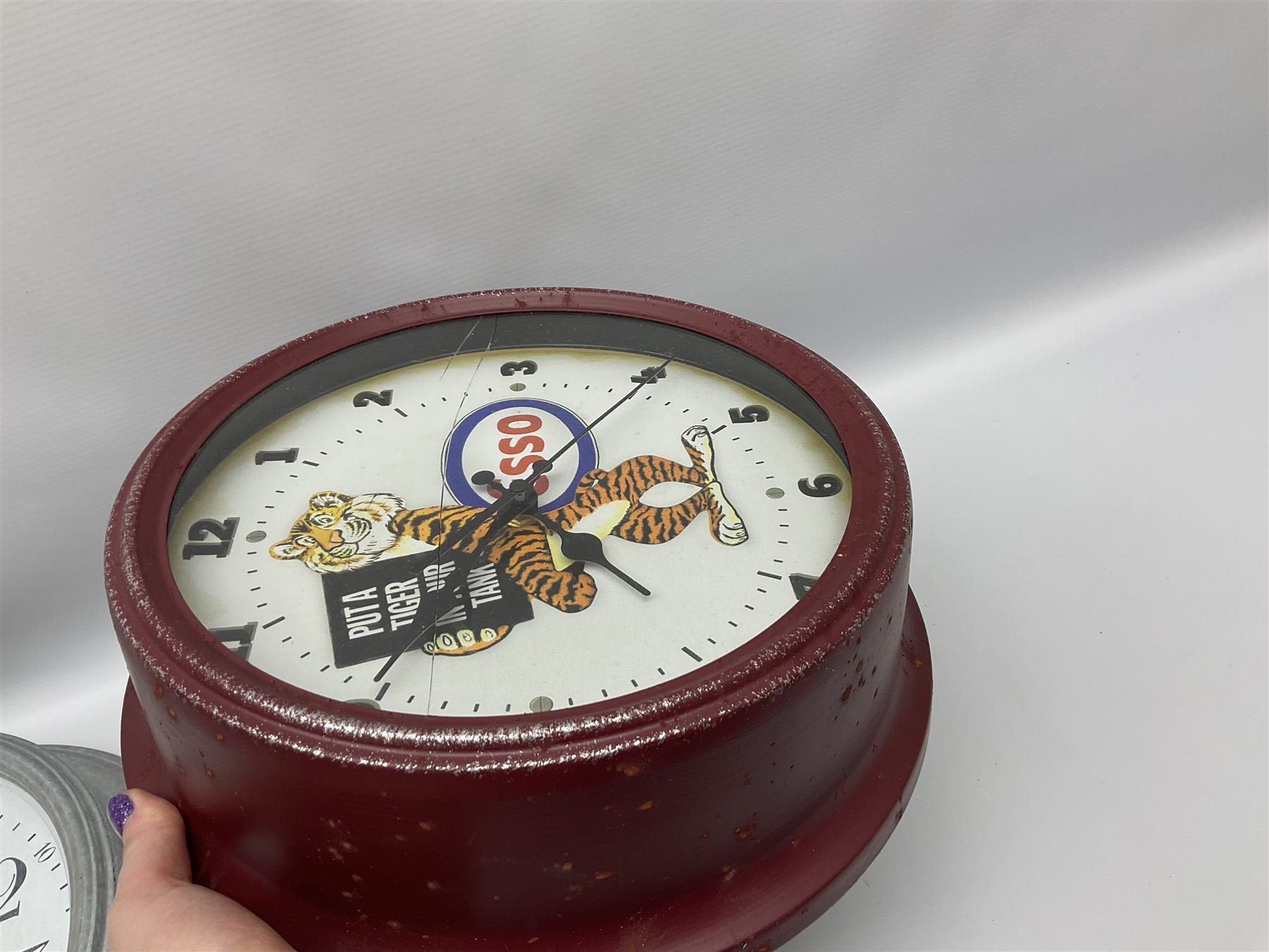 Esso Advertising Wall Clock, 'Put A Tiger In Your Tank', together with Jones & Co wall clock, largest example D40cm