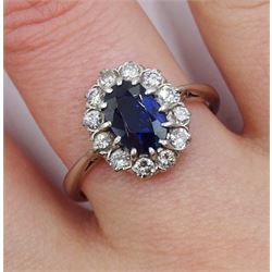 Platinum oval sapphire and diamond cluster ring