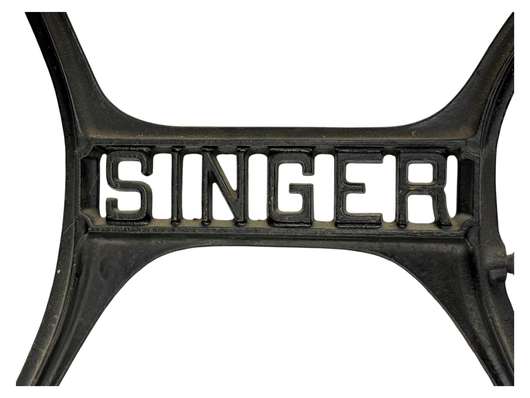 Singer - early 20th century cast iron treadle sewing machine, with hand crank wheel and oak work surface, the machine decorated with gilt foliate detail, complete with rectangular wooden cover and folding extension leaf