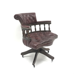  Swivel captains desk chair upholstered in deep buttoned ox blood  leather, W66cm  