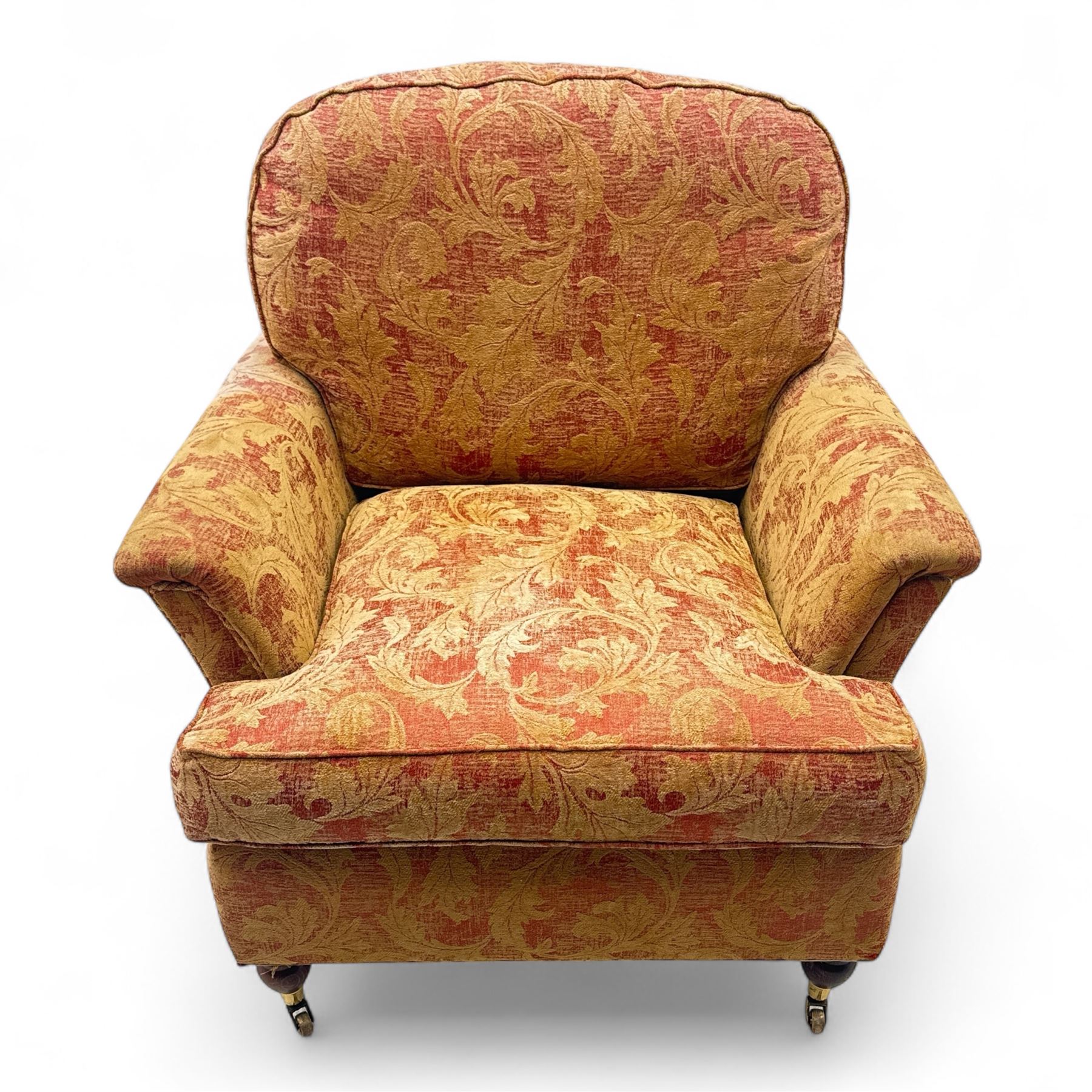 Duresta - Contemporary pair of upholstered armchairs, in red and gold damask style fabric, each with sprung seat and removable cushion back, rolled arms, on turned front supports with brass castors, square back legs 