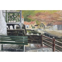 Pat Faust (British fl.1950-2000): 'Staithes', oil on board signed, titled and labelled verso 49cm x 72cm