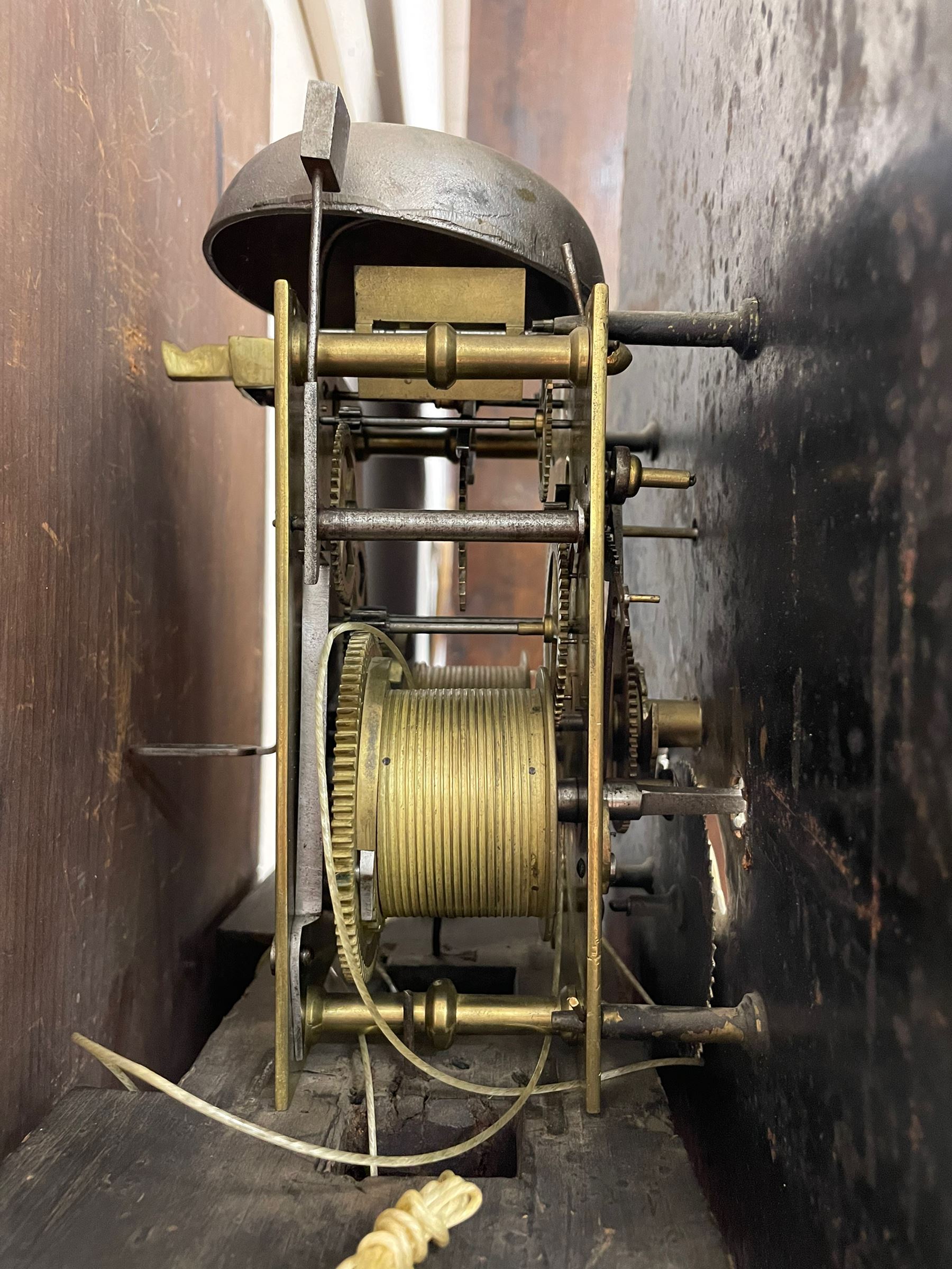 Musson of Louth - mid-19th century oak and mahogany 8-day longcase clock, with a swan’s neck pediment and ball and spire brass finial, break arch hood door flanked by reeded pilasters with brass capitals, canted angled trunk, flat topped door with concave corners, rectangular plinth on bracket feet, fully painted break arch dial with Roman numerals and minute track, subsidiary seconds dial and calendar aperture, matching stamped brass hands, eight day rack striking movement with anchor escapement. With weights and pendulum.
H206 W44 D23
Balthazar Musson from Baden (Germany) is recorded as working in Louth from 1835, naturalised 1861-8. Succeeded by his son, George Balthazar 1872-1920. 
