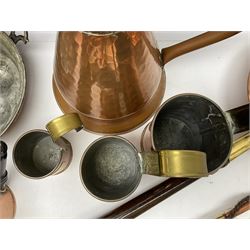 Collection of copper to include graduated set of three brass mounted cider measures, for half pint, pint and two pints, twin handled iron mounted snail/escargot pan, planished ladle, Wigan Crafts, jug etc