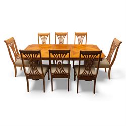 Late 20th century parquetry veneered extending dining table and eight chairs, the rectangular top with canted corners decorated with geometric parquetry panels, moulded edge frieze with repeating carved detail, raised on twin pedestal supports with fluted columns and shaped platform bases, the chairs with pierced splat backs and upholstered drop-in seats
Extends on a central leaf to 208cm