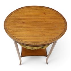 Edwardian inlaid satinwood oval sewing or work table, crossbanded and ebony-strung hinged top enclosing fitted compartment and olive-green upholstered well, raised on square tapering splayed supports united by under-tier 