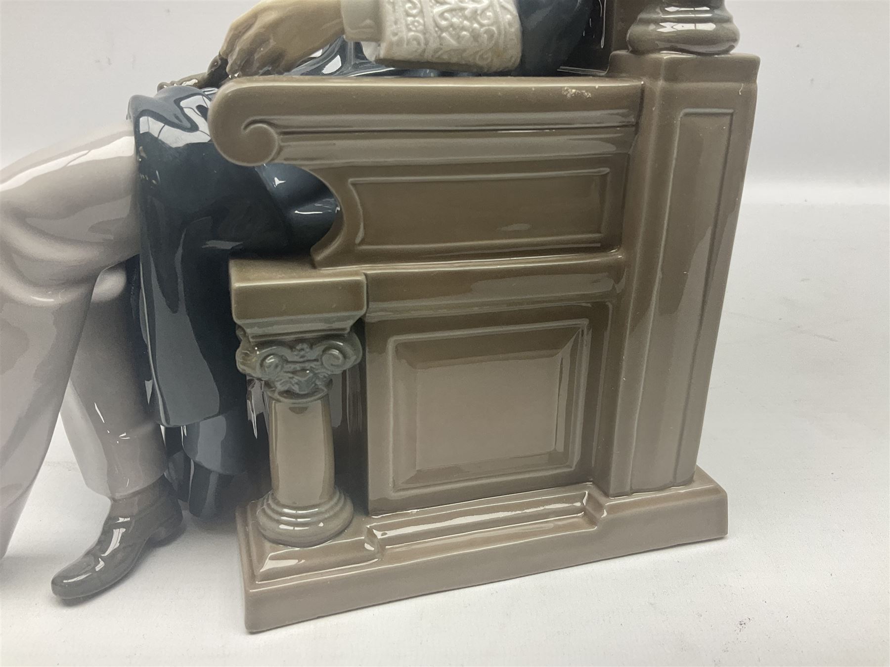 Lladro figure, Justice, modelled as a judge sat in a char, sculpted by Salvador Furió, with original box, no 5489, year issued 1988, year retired 1993, H34cm 