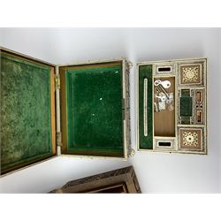 An early 20th century Indian Vizagapatam box, detailed with pierced ivory panels and raised upon four paw feet, H8cm L20.5cm D15.5cm, together with an Eastern hardwood box carved with foliate panels. 