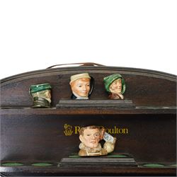 Collection of  forty two miniature Royal Doulton character jugs on three wall shelves, one inscribed Royal Doulton