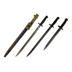 British Pattern 1907 bayonet with 43.5cm fullered steel blade; in leather scabbard with webbing frog L58cm overall; another Pattern 1907 bayonet lacking scabbard; and British Pattern 1888 Mk.I bayonet by Wilkinson London (no scabbard) (3)