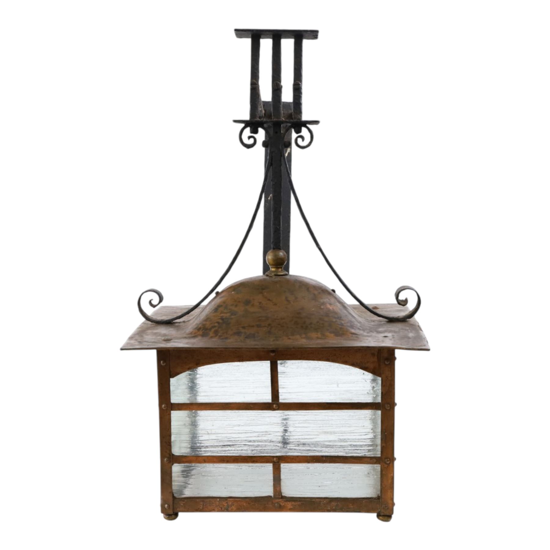 20th century, Arts and Crafts style copper porch lantern, of rectangular form, with cast iron scrolling wall fittings