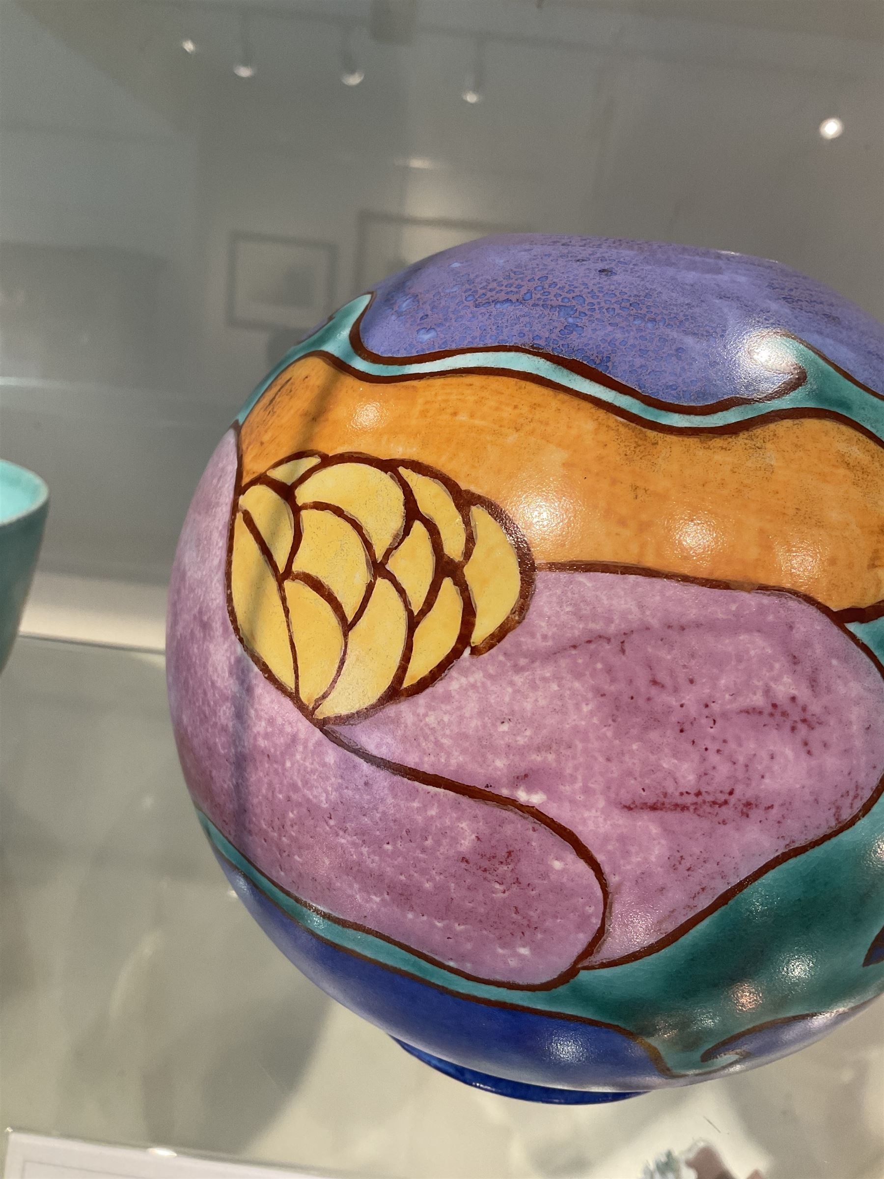Clarice Cliff Bizarre for Newport Pottery Inspiration Tresco pattern vase, the body of shape 370 globe form painted in yellow, orange, pink, purple, green and blue with stylised island and sea related motifs such as scales and seaweed, with painted and impressed marks beneath, H15cm