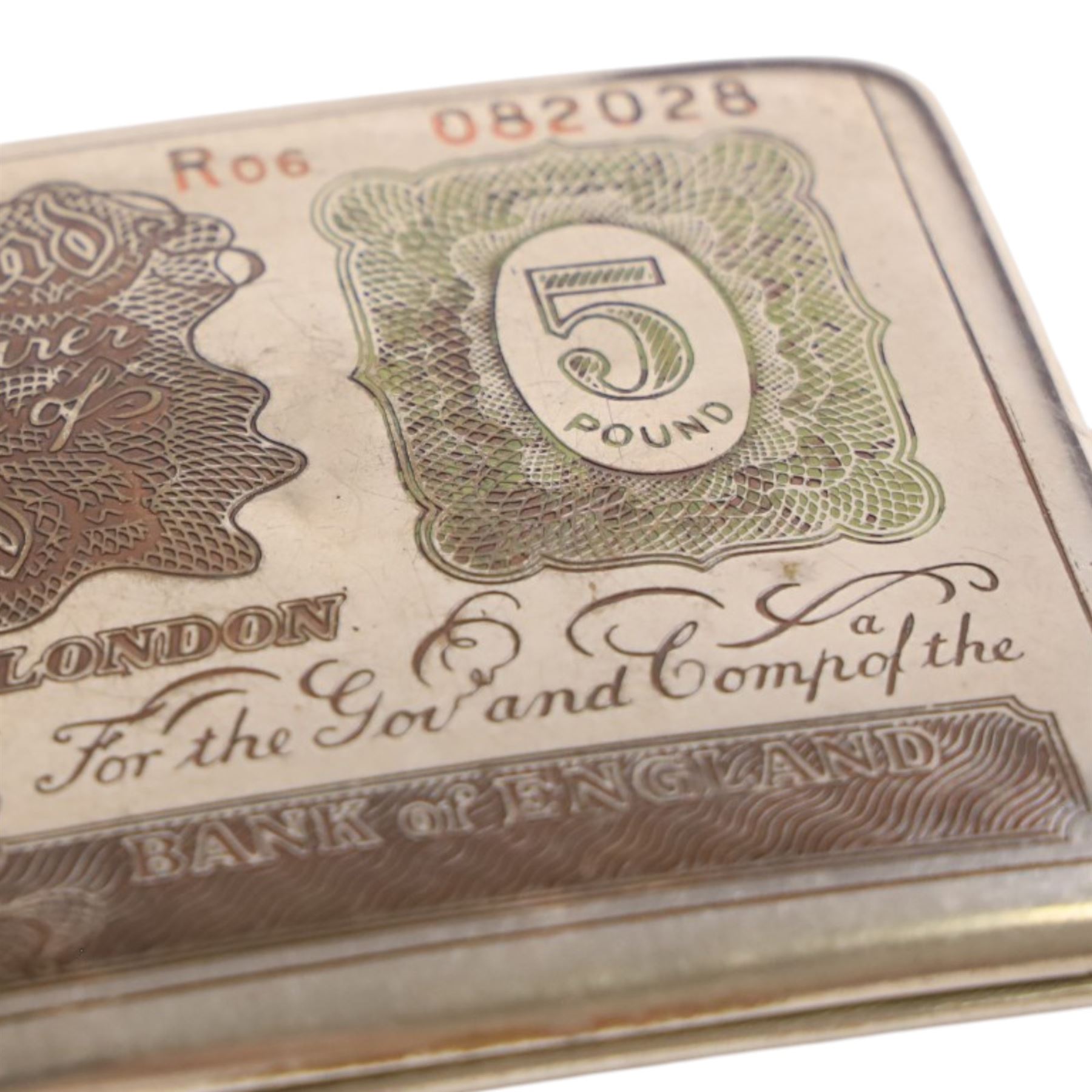 Three cigarette cases, modelled as bank notes, together with a smokers set including ashtray, cigarette case, ligher and cigarette holder, cased and other cigarette holders 