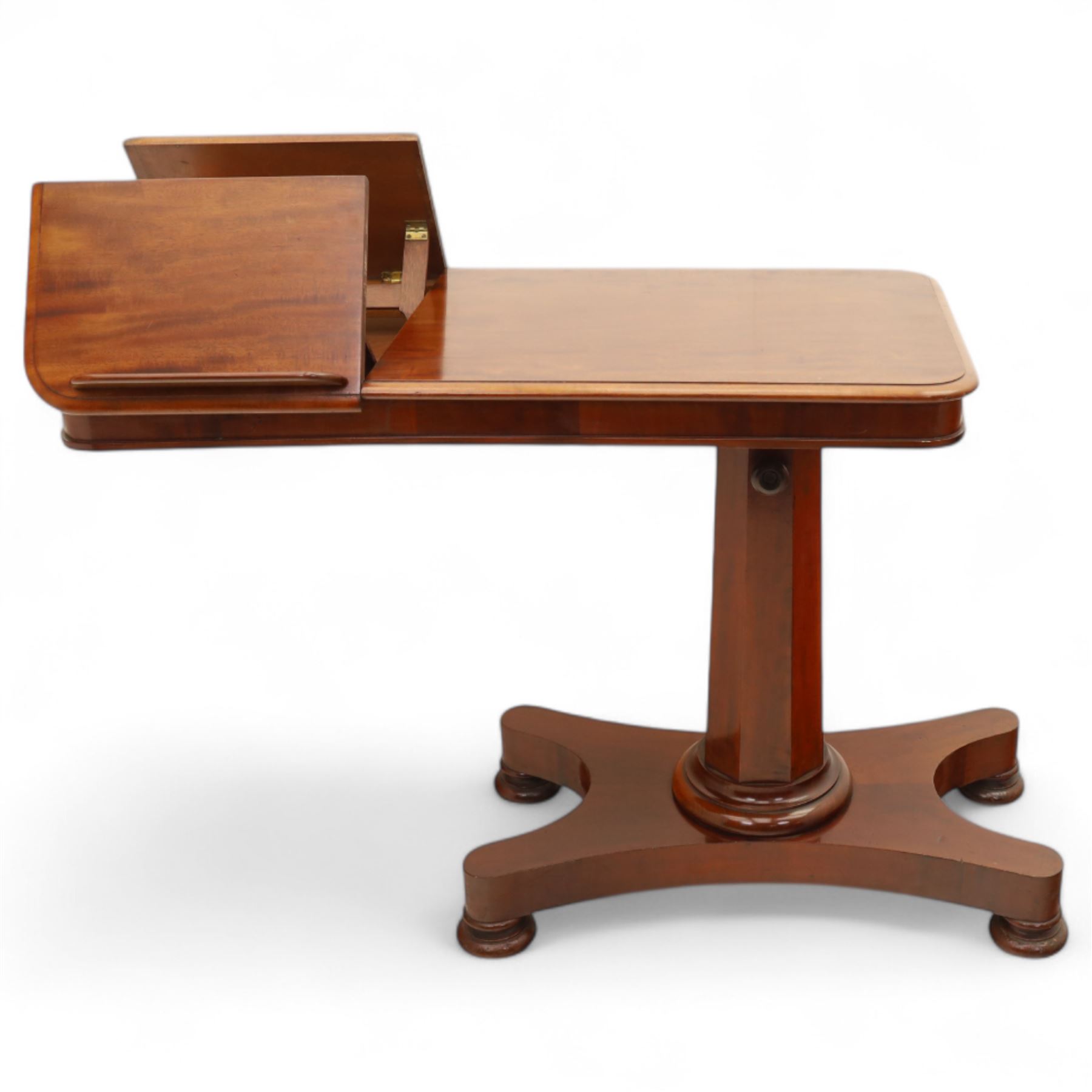 William IV mahogany reading table, the rectangular top with rounded corners and moulded edge, one end fitted with two hinged adjustable reading slops with two rests, the sliding top with a sprung stay mechanism, supported on a single tapered faceted column  with turned collar on a quatreform base with compressed bun feet