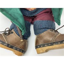 Lakeland Bears teddy bear, titled 'Walkright', dressed as a hiker in green corduroy duffle coat over fair isle jumper, trousers and knit socks, complete with leather clogs with wood soles, walkers thumb stick, knitted scarf, flat cap and rucksack housing original tag and map, H50cm