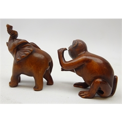  Japanese Meiji boxwood Netsuke carved as a monkey, L5cm and Elephant, both with glass eyes and signatures (2) Provenance: private collection   