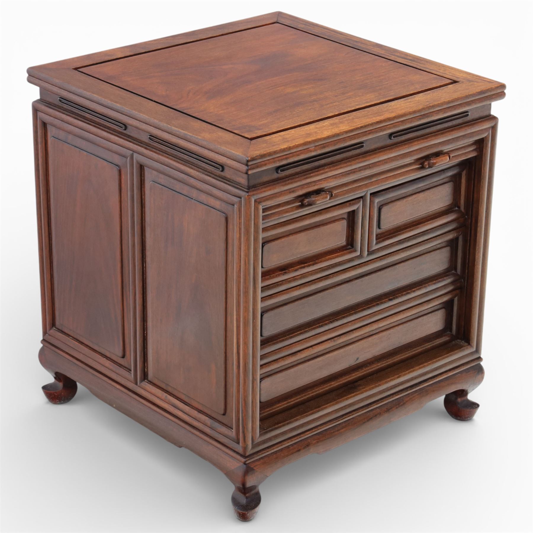 Early 20th century Chinese hardwood filing cabinet, moulded rectangular top over a tambour shutter front with twin recessed handles enclosing an arrangement of graduated drawers, raised on short cabriole legs with shaped apron