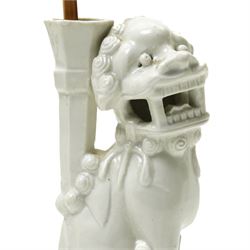 Pair of 19th century Chinese blanc de chine joss stick holders in the form of  Buddhist lions on rectangular bases H20cm (2)