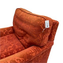 Howard style armchair, upholstered in red patterned fabric, on turned front feet