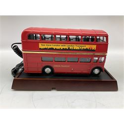 Novelty telephone in the form of a London Routemaster bus, c1997, fitted on wooden plinth with modern connection L25.5cm