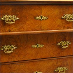 Tall late 19th century walnut chest, stepped and moulded top over six drawers, ornate cast gilt metal handles, enclosed by turned and fluted upright columns, on turned front feet 