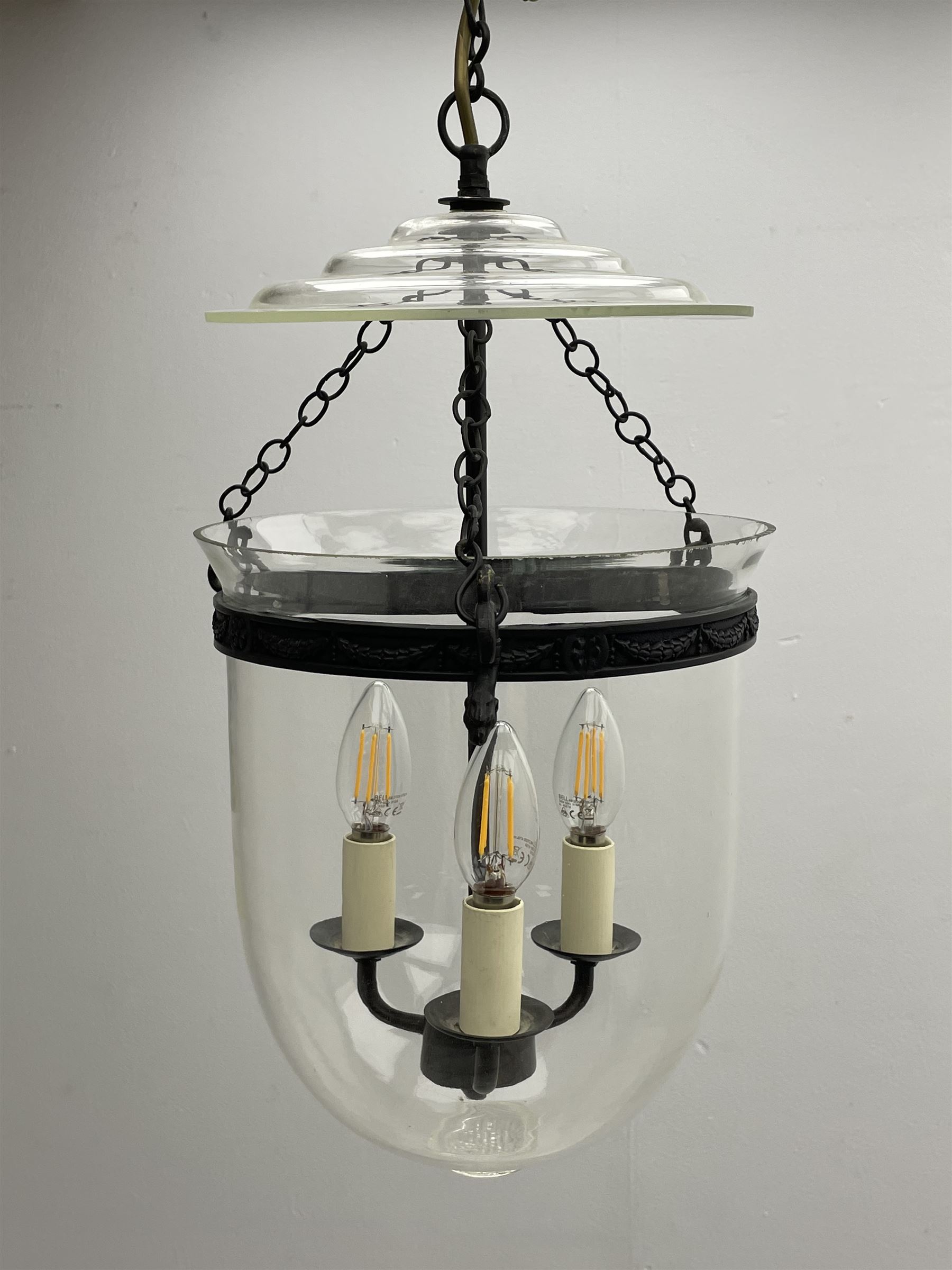 Vaughan Designs - Regency design bronzed metal and glass hall lantern, three branch light in glass bell, the band decorated with bell flower garlands and serpentine mythical beast chain brackets