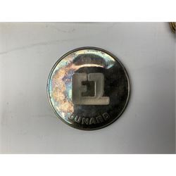 Silver 1969 Cunard RMS Queen Elizabeth maiden voyage commemorative medallion, in original Slade, Hampton & Son case with certificate, two Stratton R.M.S Queen Elizabeth mirror compacts, Stratton R.M.S Queen Mary compact, mid 20th century P&O Canberra Round World Voyage miniature globe, S.S Oriana ash tray modelled as a barrel, Norah Wellings sailor doll, and other maritime and shipping memorabilia 