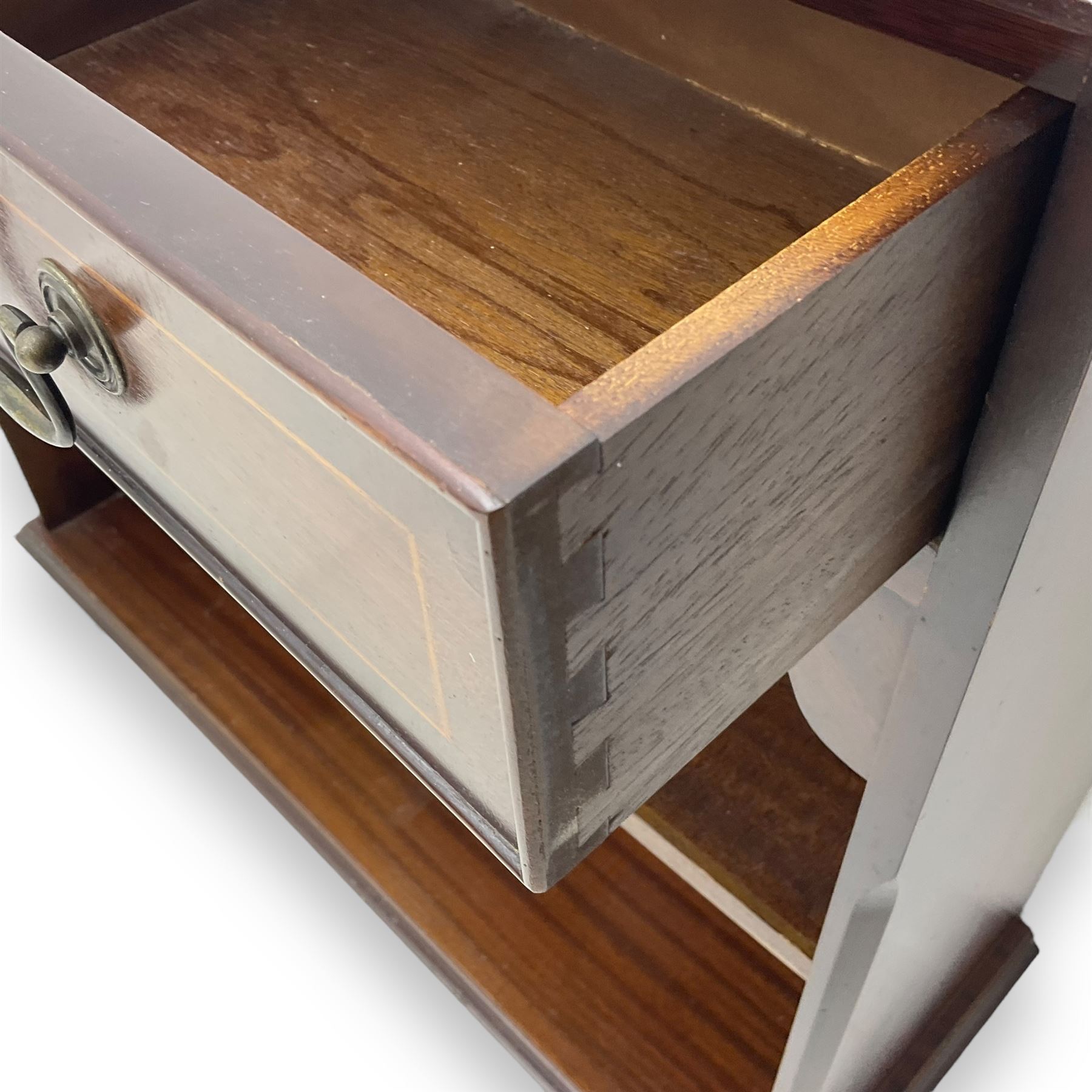 Early 20th century inlaid mahogany open bookcase, rectangular top with boxwood stringing and moulded edge over two short drawers, two open shelves below, on shaped bracket supports