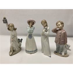 Eleven Nao figures to include Cowboy, Girl with Puppy, Clown, Girl in hat etc 