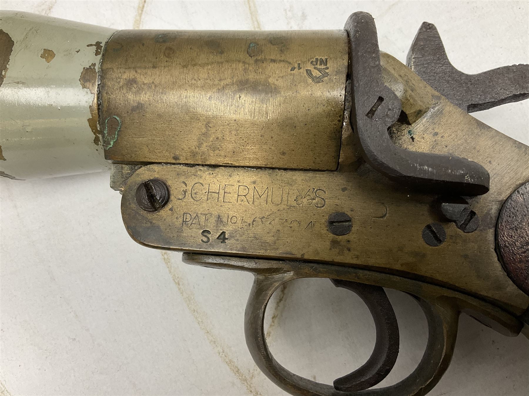 Schermulys Patent No.503324 nitro proof line throwing pistol No.15003; brass body with proof marks; the 32cm steel barrel with secondary handle over and original transfer 'The Schermuly Pistol Rocket Apparatus Ltd. London' L51cm overall
