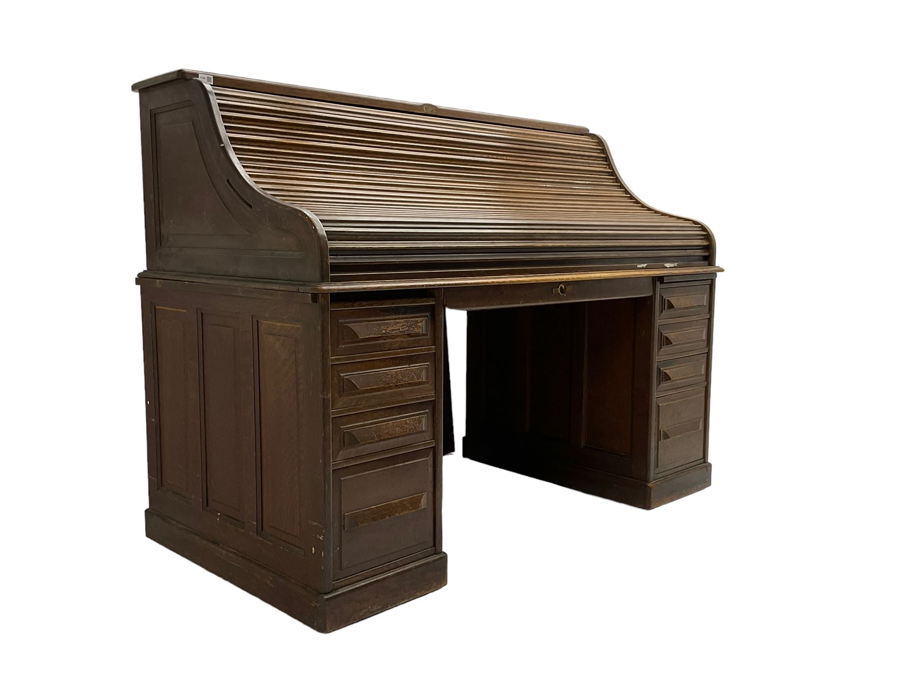 Cutler - early 20th century American oak tambour roll-top desk, the twin pedestals fitted with four graduating drawers