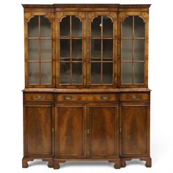 Georgian design mahogany breakfront bookcase on cupboard, projecting cornice over four arc...