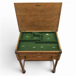Early 20th century oak cased canteen on barleytwist stand, hinged top with fitted baized lined interior, above a drawer fitted for cutlery