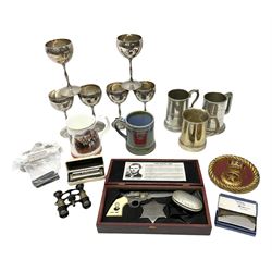Set of six plated goblets each engraved with 'Guest 7 Sig Regt', various tankards, snuff box engraved 'F. Dean' and with cricketing scene to the reverse, cricketing fobs including hallmarked silver examples, two vintage duck calls, novelty Jesse James folding knife, Marine Band harmonica, cast metal and painted circular  plaque, binoculars, etc