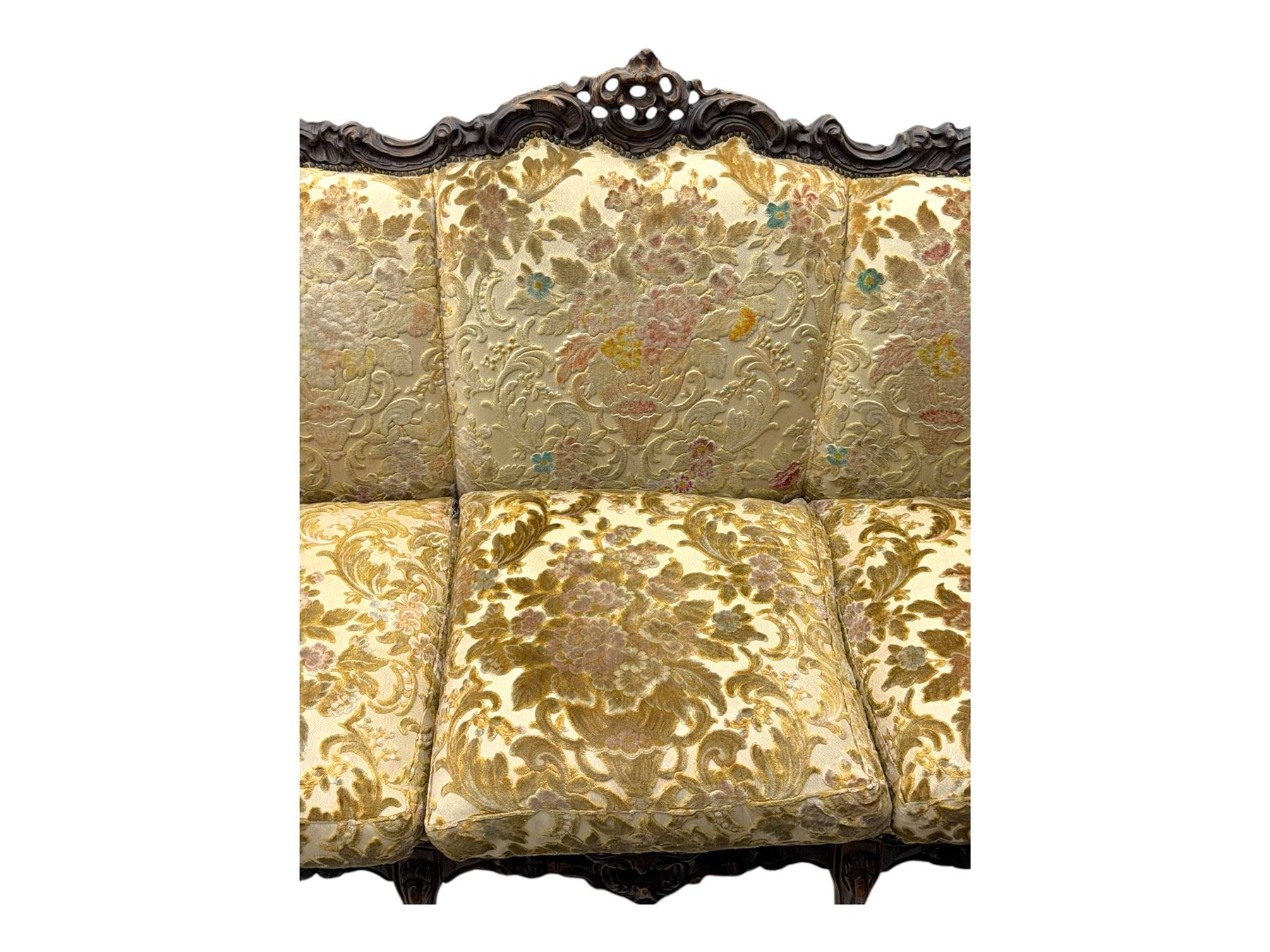 Victorian design stained wood three seater settee, top rail carved and scrolled, padded back and arms, scrolled cabriole feet 