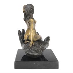 Nude In Hand bronze sculpture modeled as a female nude seated in a hand upon a marble base, signed June H24cm   