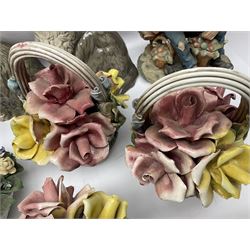 Two Royal Doulton cats, two Capodimonte style figures, and four ceramic baskets of flowers 