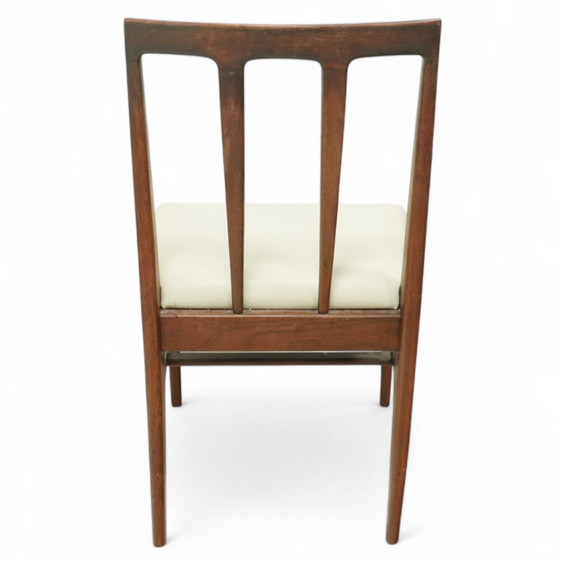 John Herbert for A. Younger  - Mid-century afrormosia teak Volnay dining table, of rectangular form with chamfered edges raised on tapering legs united by rounded stretchers, together with four afrormosia Volnay dining chairs with a gently curved top rail over triple splat open back on square tapering legs united by stretchers reupholstered in cream vinyl, chairs W50xD42xH88cm