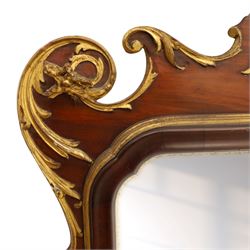 Large George III mahogany wall mirror, parcel gilt shaped frame with scrolling acanthus, shell and foliate decoration, surmounted by carved gilt ho-ho bird, rectangular mirror plate within moulded border, shaped apron with gilt scroll terminals, removed from a Scottish country estate