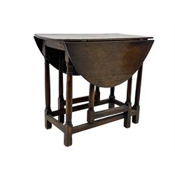 19th century oak gateleg table, the oval drop-leaf top formed of four planks, on turned column supports united by rectangular stretchers
