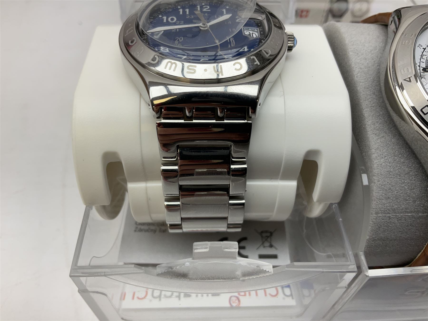 Swatch Irony chronograph stainless steel quartz wristwatch, on original tan leather strap and one other Irony quartz wristwatch, on stainless steel strap both boxed (2)