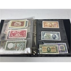 World banknotes, including Queen Elizabeth II The States of Jersey one pound 'DB202703', five pounds 'BB527762' and ten pounds 'AB651481', reserve bank of New Zealand two dollars '1L3 741894', King George V Straits Settlements one dollar 1st January 1935 'F/83 28924', various Bank of England notes etc, housed in two ring binder albums