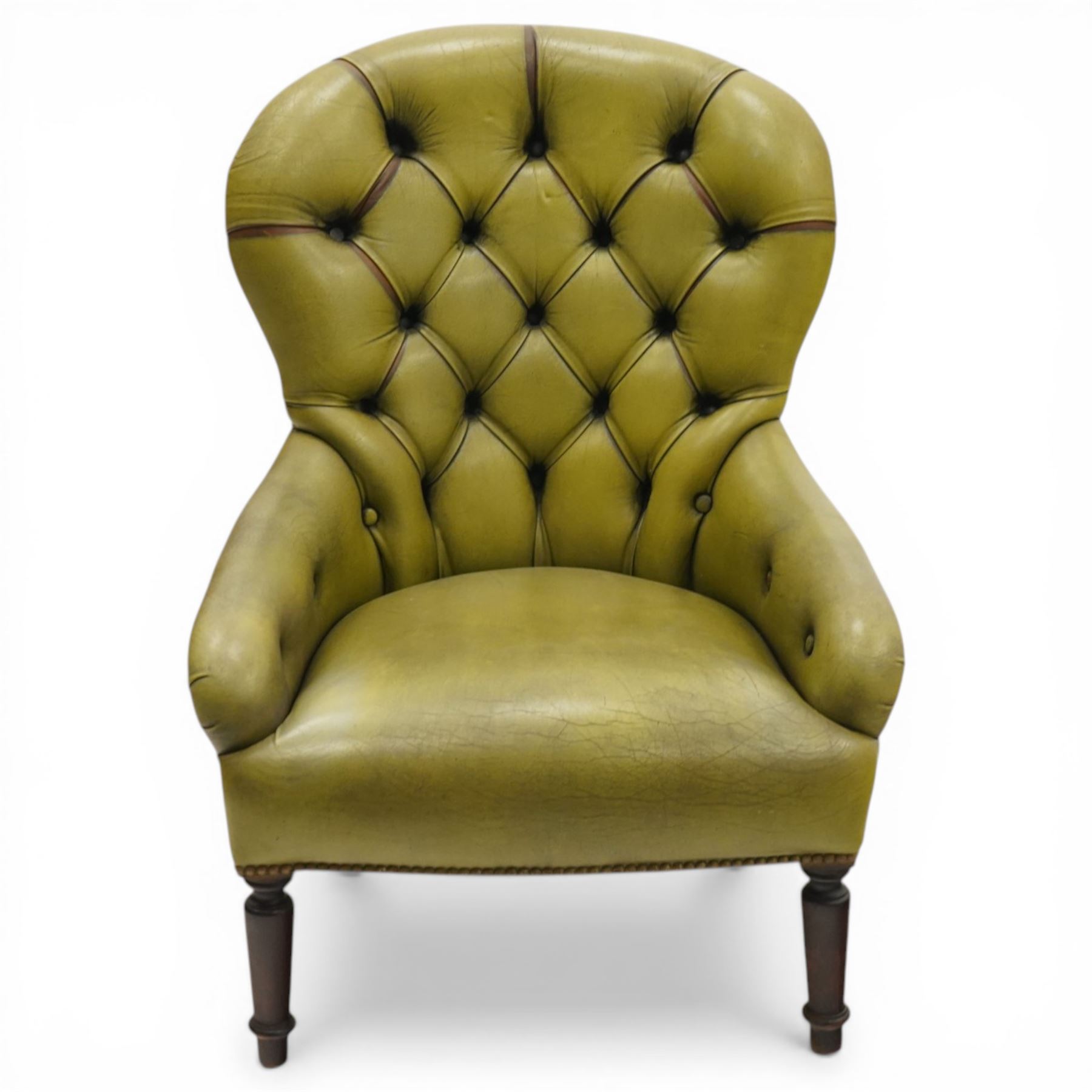 Victorian design tub armchair upholstered in buttoned green leather, on turned front supports