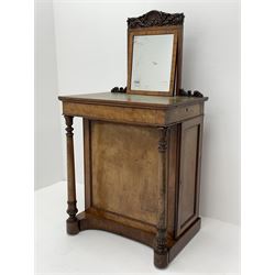 Early Victorian figured mahogany dressing cabinet, the raised shell and scroll carved back lifts to reveal rectangular easel mirror with mahogany band, flat rectangular top with tooled leather inset, slide at each side with matching leather inset, full width drawer above cupboard enclosing a series of five drawers, turned front supports, panelled front, sides and back