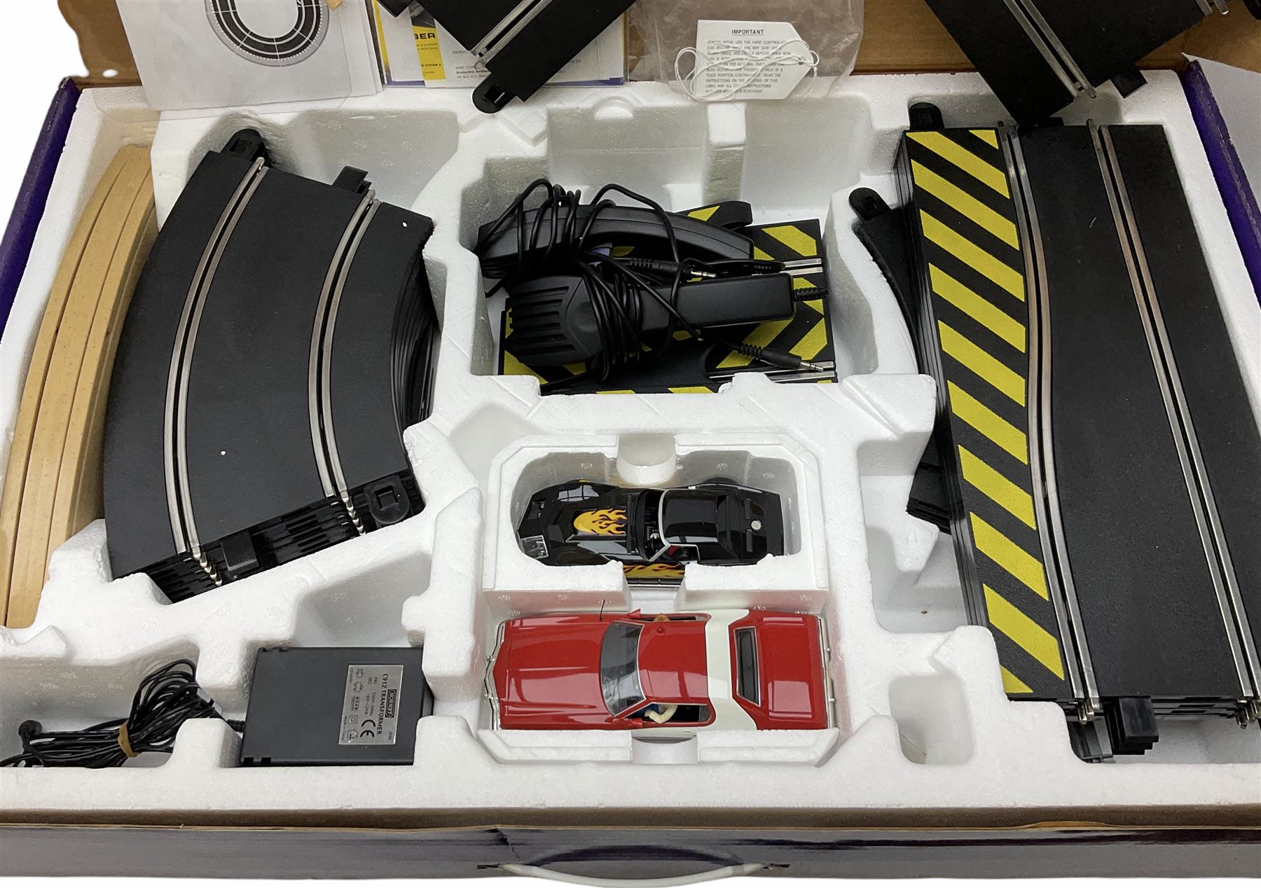 Scalextric - Marks & Spencer Starsky & Hutch set with '76 Gran Torino and Chevrolet Corvette cars, boxed; an earlier Tri-ang Scalextric 'Set 30' Model Motor Racing set containing Lotus and Cooper racing cars with controllers, track, figures and instruction pack, boxed; and a Scalextric catalogue Fifth edition c1964