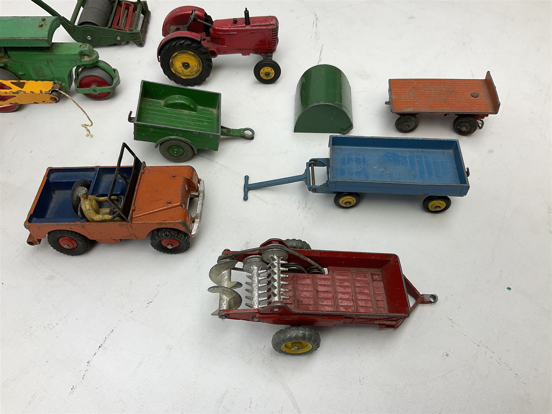 Dinky - nineteen unboxed and playworn/repainted die-cast models including Muir Hill Dumper, Muir Hill 2WL and Heavy Tractor; all repainted; Coles Mobile Crane, two Aveling-Barford steam rollers; Massey-Harris tractor and manure spreader; Land Rover; nine various trailers etc (19)