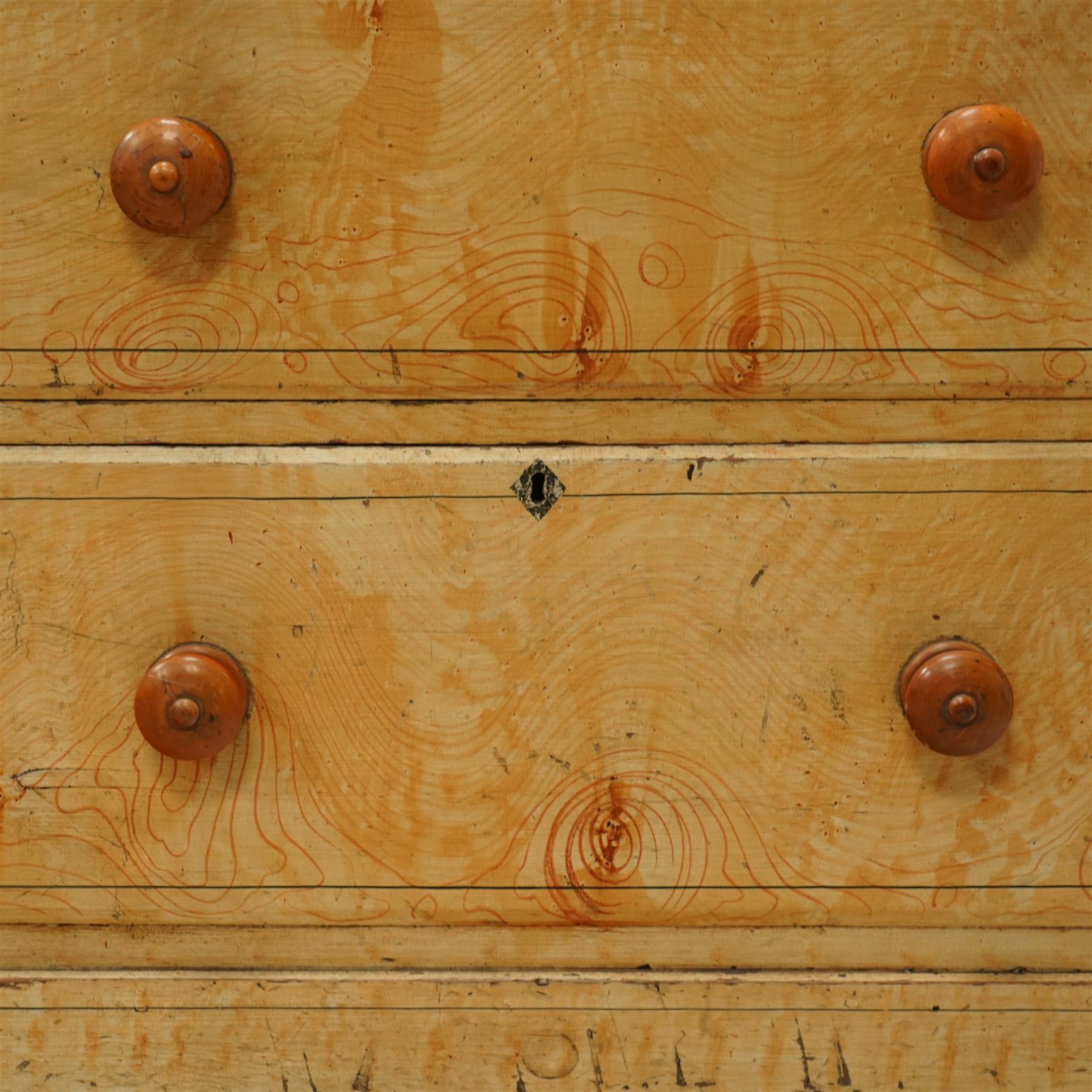 19th century pine painted chest of drawers, rectangular moulded top above two short and three graduated long drawers, each with painted foliate scroll and line detailing, turned knobs, and concealed turned feet, the sides with rounded corners and ebonised detail