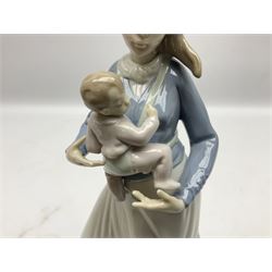 Three Lladro figures, comprising Modern Mother no 5873, Dropping the Flowers no 1285 and On the Beach no 1481, all with original boxes, largest example H30cm