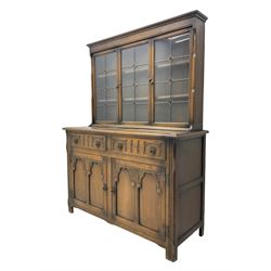 Mid-20th century oak dresser, raised back enclosed by three lead glazed doors, fitted with two drawers and two cupboards