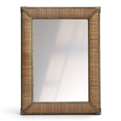 Rustic wall mirror with brass, leather and rattan frame, enclosing a bevelled plate